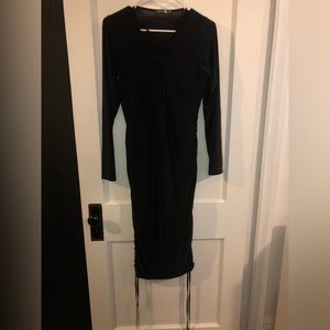 Black dress with tied detailing on the sides